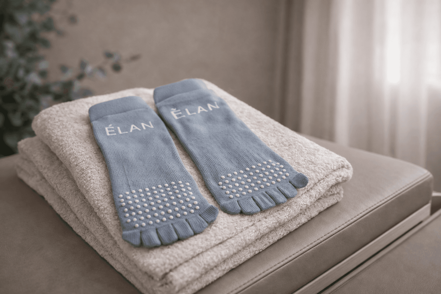 ELAN grip socks arranged on folded studio towels